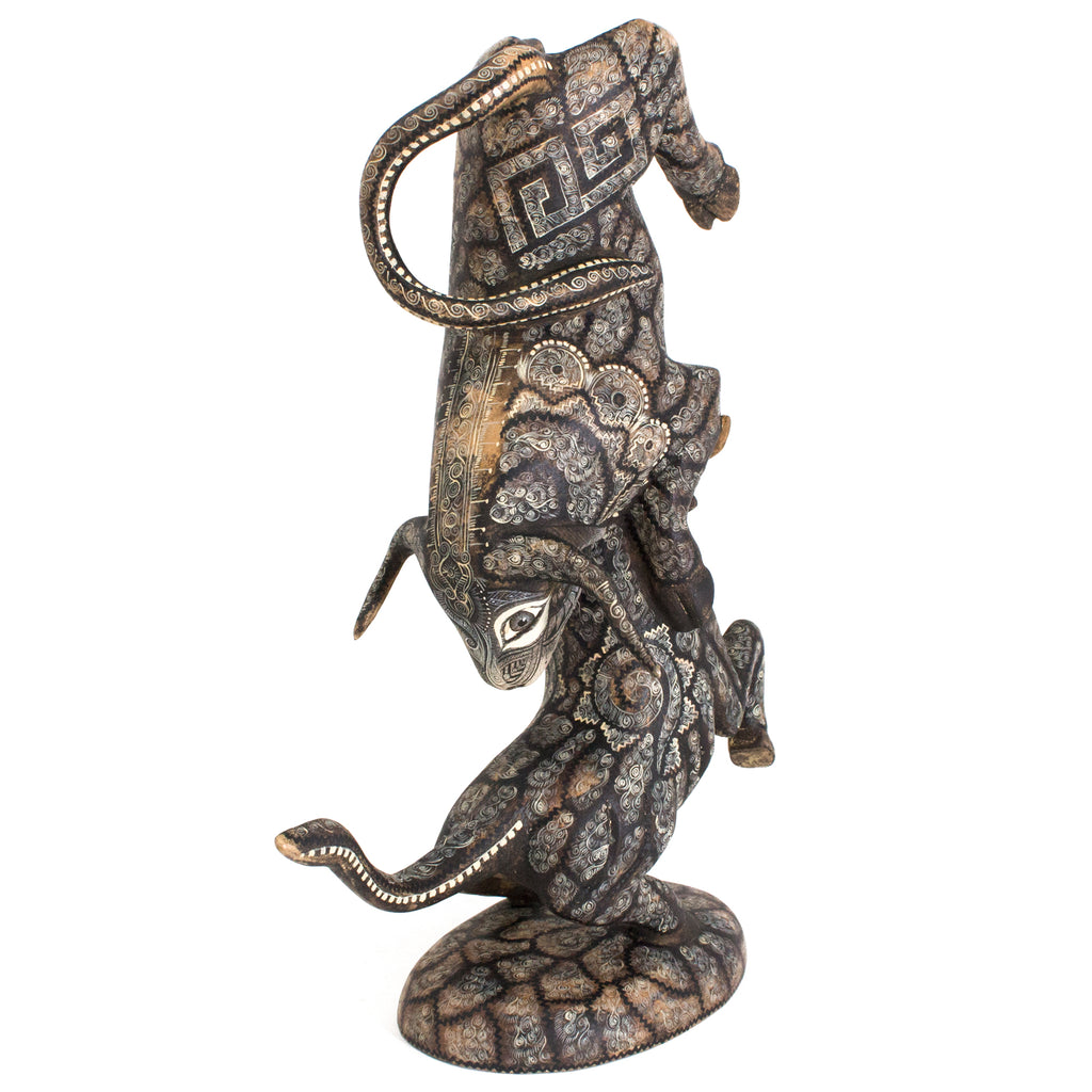 Two Bulls Fighting, Copal Wood