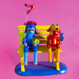 Dog Lovers sitting on a bench, Betus Clay