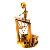 Welder Over a Structure, Recycled Metal