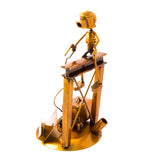 Welder Over a Structure, Recycled Metal