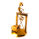 Welder Over a Structure, Recycled Metal